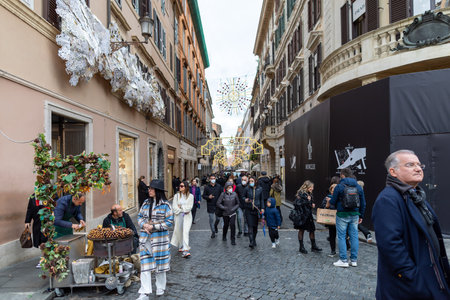 Rome, Italy - November 28, 2021: Crowd of tourists and citizens in Via Condotti during the Christmas shopping, in the historic center of the capital.のeditorial素材
