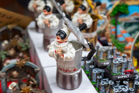 Naples, Italy - December 24, 2021: typical Neapolitan objects, pulcinella and the coffee machine, for sale in the stalls of San Gregorio Armeno.のeditorial素材