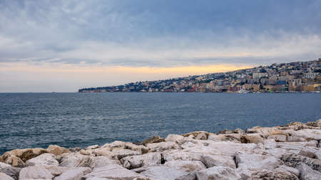 Waterfront of Naples, Italy. Cityscape of the city with the skyline of the Posillipo hill and its residential buildings.の写真素材