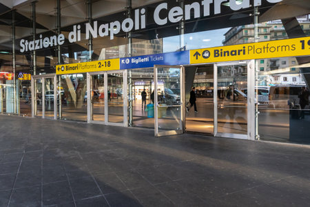 Naples, Italy - February 12, 2020: a main entrance of Garibaldi central railway station. Tourists with bags and suitcases rush to access the train tracks.のeditorial素材
