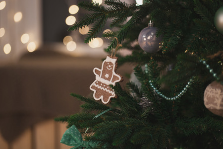 Christmas tree with hanging toys in the form of a cookie man new yearの写真素材