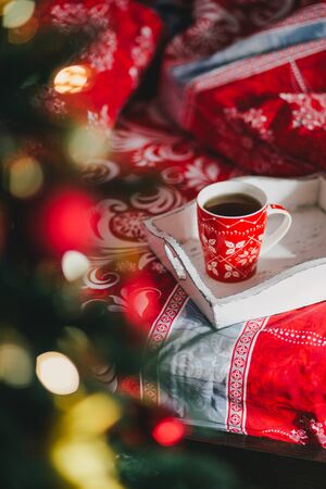 Interior with Christmas tree in a cozy bedroom. Holiday morningの写真素材