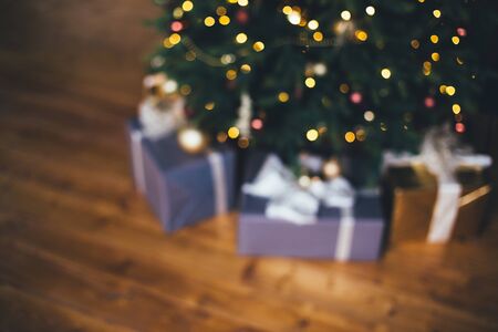 Blurred defocused image of Christmas interior. Christmas tree and presents.の写真素材