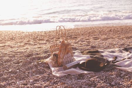 Picnic at beach with fresh baguettes, jam and honey and hot teaの写真素材