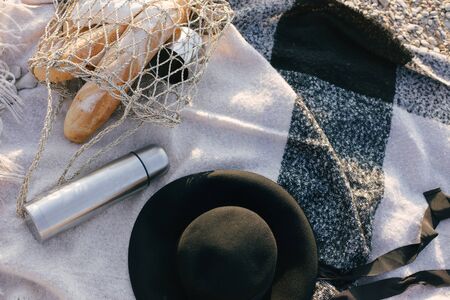Picnic at beach with fresh baguettes, jam and honey and hot teaの写真素材