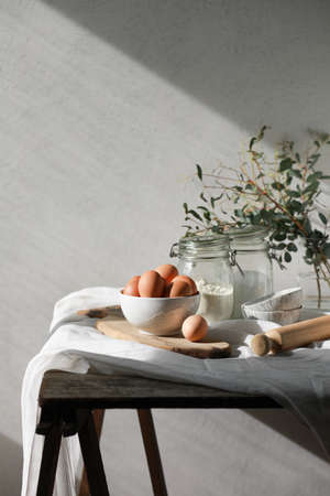 Bakery ingredients for homemade cooking or baking on table. Food set on wooden table. Copy spaceの写真素材
