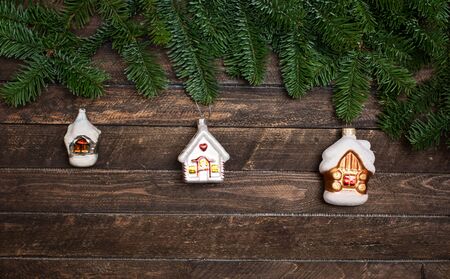 Set of old vintage toys houses for decorating Christmas tree on rustic wooden background. New year...