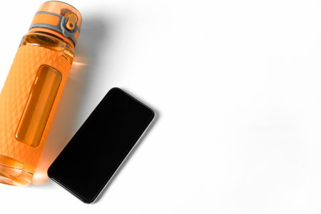 Fitness Bottle And Phone Mock Up On Isolated White Background. Personal Exercise Activity Gadget...