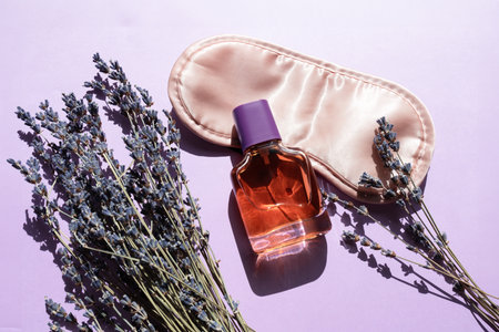 Healthy sleep concept. Relax composition with sleep mask and lavender flowersの写真素材
