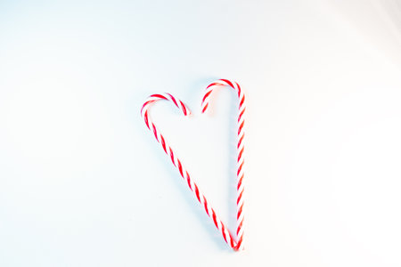 Christmas candy cane in a form of heartの写真素材