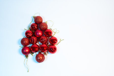 Red Christmas decoration, red shiny balls in a form of Christmas treeの写真素材
