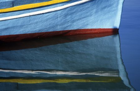 a reflection of a fish boat in a riverの写真素材