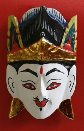 a close up of a wooden face