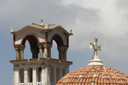 a simple frame with cross , roof and blue skyの写真素材