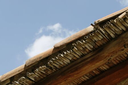 a detail of a traditional roof in a villageの写真素材
