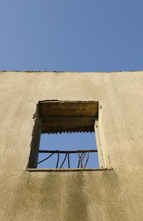 an old wall with a frame windowの写真素材