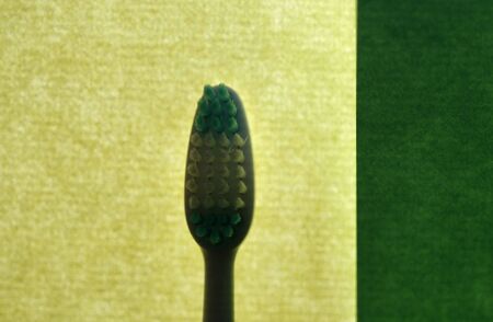 a simple green background , texture with toothbrushの写真素材