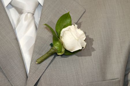 a simple background with gray costume and white rose