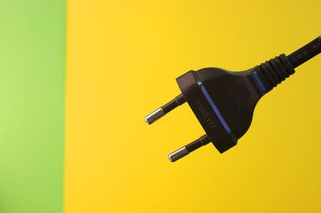an  electricity fuse adapter in a simple yellow backgroundの写真素材