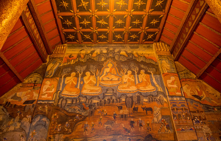 Nan, Thailand - April 25, 2016: painting a mural of the famous man whispered in the ear of the woman. The measure Phumin a famous temple in Nan, Thailand.の写真素材