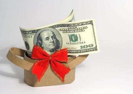 cardboard basket with red bow and moneyの写真素材