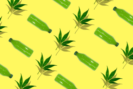 Pattern of cbd drink and canabis leaf on a yellow background.の写真素材