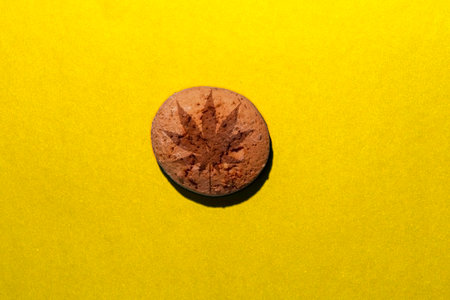 Hemp biscuits on a yellow background. Marijuana CBD dessert.