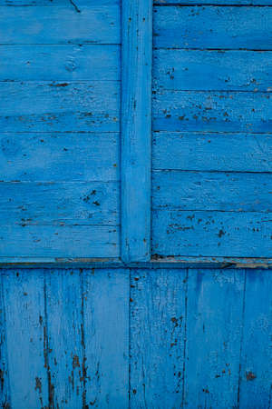blue wall from vertically and horizontally laid boardsの写真素材