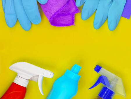 Colorful cleaning set for different surfaces in kitchen, bathroom and other rooms. Empty place for...
