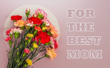 Bouquet of carnations on a pink background with a copy space. Mother's day greeting card.の写真素材