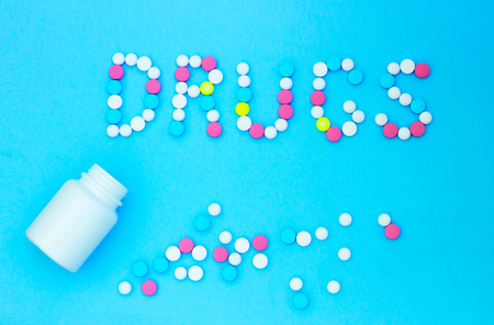 inscription drugs on a blue background. Medical Conceptの写真素材