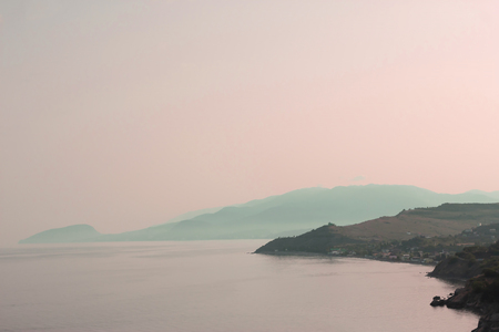The view from the height of the mountain in the sea at sunset. Crimea landscape
