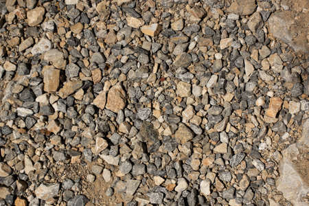 Multi colored pebbles background. Natural stone. Close-up texture of pebbles.の写真素材