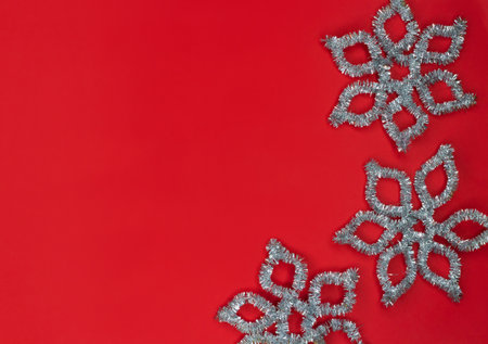 Christmas background in red with silver snowflakes.の写真素材