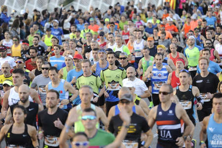 VALENCIA, SPAIN - 1 DECEMBER 2019: Crowd of runners at the start of the Marathon of Valencia 2019のeditorial素材