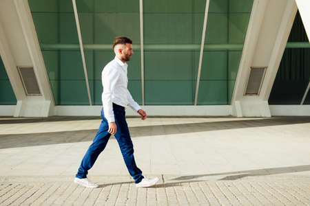 shirtless young man with skateboarding over shoulders under perspective frame