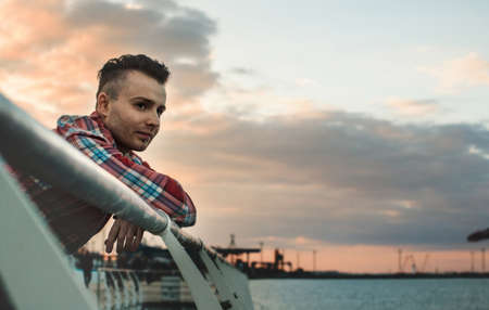 handsome guy in a plaid shirt posing. close-upの写真素材