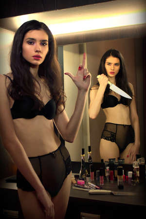 beautiful sexy brunette in black underwear posing. noir styleの写真素材