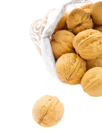 Walnuts in bag isolated on white backgroundの写真素材