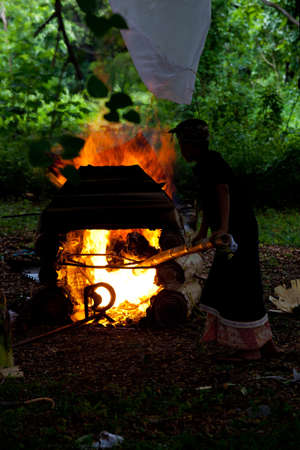 cremation process, burning dead body, traditional funeral ceremony on Bali, Indonesia
