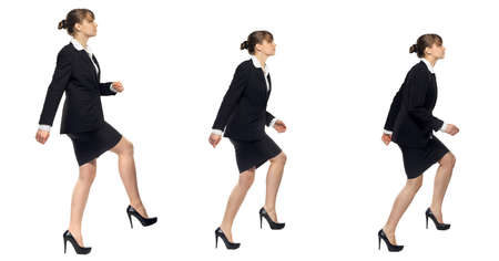 business woman walking up, different positions, isolated on white backgroundの写真素材