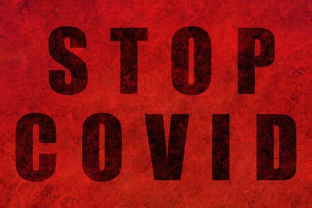 Stop covid design on a red textured background. Concept Stop covid-19.の写真素材