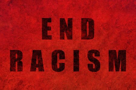 End racism. Design with a powerful message against racism printed on a red textured background.の写真素材