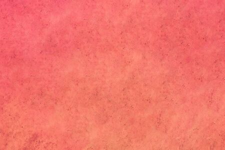 Red-orange background with grunge texture.の写真素材