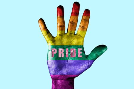 Open palm with the colors of the rainbow of gay pride. LGBT equal rights movement and gender...