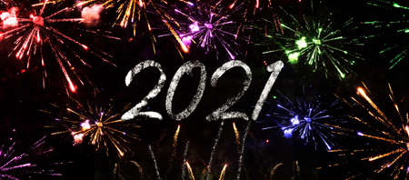 Happy new year 2021 with firework background. Firework display colorful for holidays. Poster, banner, billboard or greeting card for merry christmas and happy new year celebration.の写真素材