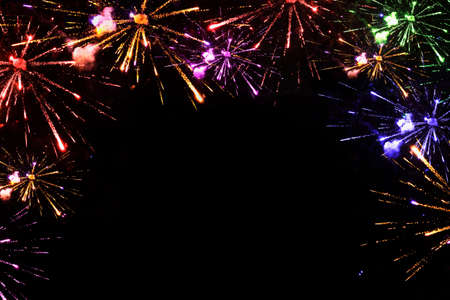 Colorful fireworks with wide dark copy space. Bright and beautiful fireworks and rockets of...