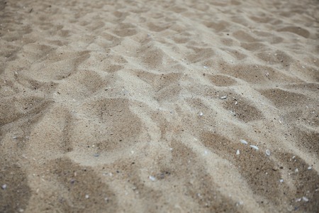 Fine beach sand in the summer sun as background