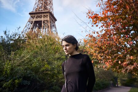 Beautiful dreamy girl posing on the background of the Eiffel Tower. Paris, Champ de Marsの写真素材