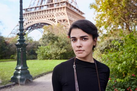 Beautiful dreamy girl posing on the background of the Eiffel Tower. Paris, Champ de Marsの写真素材